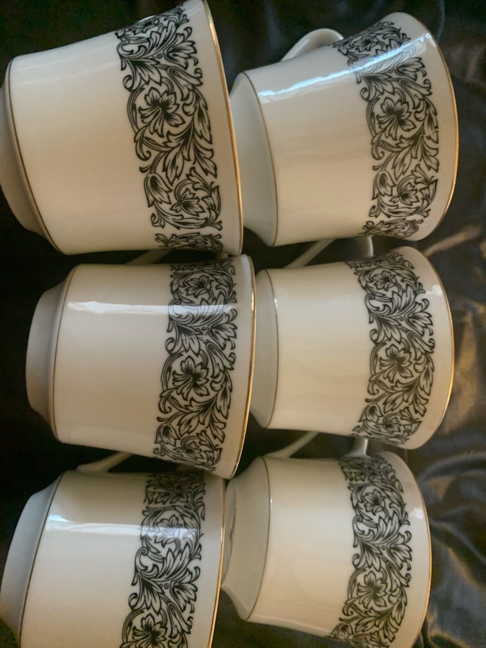Elegant White Porcelain Tea Cups with Black Scroll Floral Band